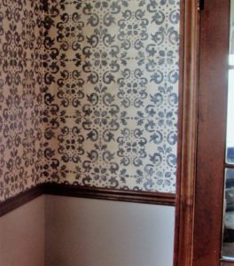 stenciled wall with chairrail