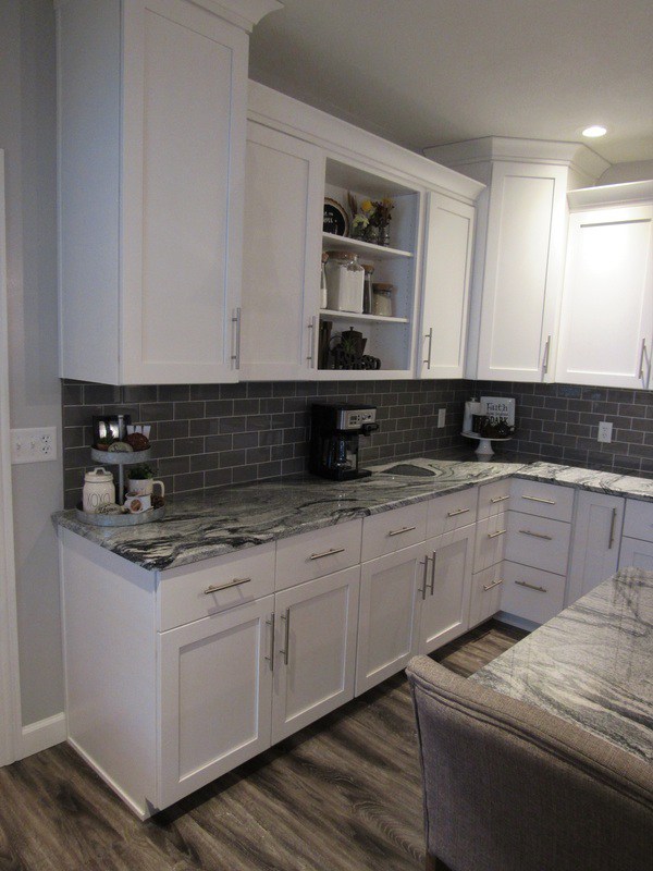 kitchen remodel open shelf staggered cabinets